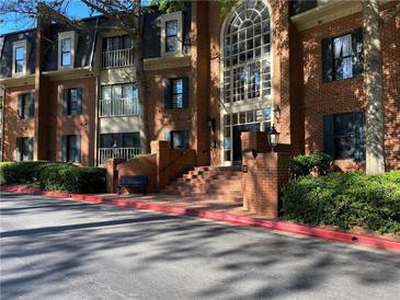 Inviting brick building facade with grand entrance, large windows, and well-maintained landscaping at 23210 Plantation Ne Dr, Atlanta, GA 30324