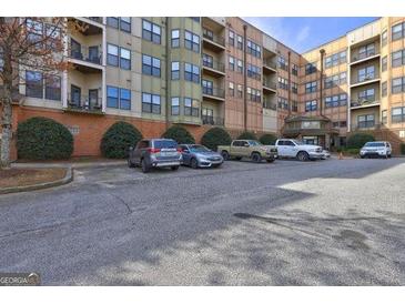 Multi-story condo with ample parking, mature trees, and brick facade at 898 Oak # 3421, Atlanta, GA 30310