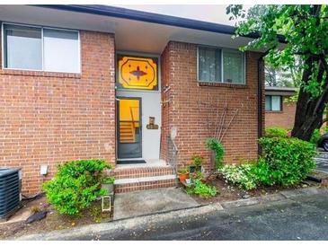 Charming brick home with a unique stained-glass window above the front door at 2570 Bradford Ne Sq, Atlanta, GA 30345