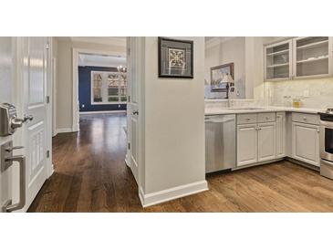 Bright kitchen features stainless steel appliances, white cabinets and light countertops at 850 Piedmont Ave # 2102, Atlanta, GA 30308