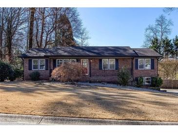 Charming brick ranch-style home with a well-maintained front yard and mature trees at 510 Debra Dr, Marietta, GA 30066