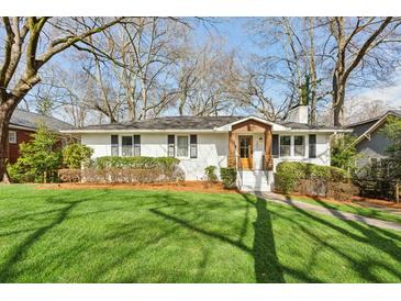 Charming single-story home with a well-manicured lawn and inviting curb appeal at 201 Seminole Ne Dr, Marietta, GA 30060