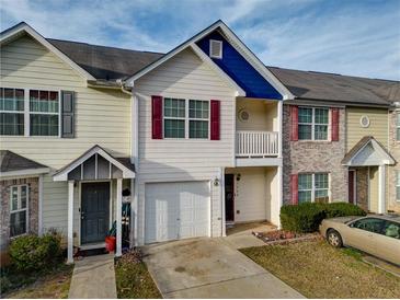 Charming townhouse with attached garage, small porch, and well-maintained lawn at 1769 Old Dogwood, Jonesboro, GA 30238