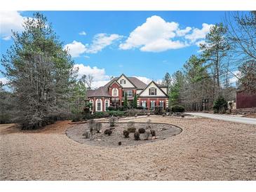 Stately brick home boasts meticulous landscaping and a circular driveway at 3647 Little Spg, Stockbridge, GA 30281