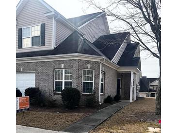 Charming two-story home with brick facade and inviting front porch at 2555 Flat Shoals Rd # 1705, Atlanta, GA 30349