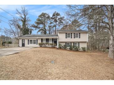 Charming two-story home with neutral siding, black shutters, and a well-maintained front yard at 3898 Rosedale Ln, Douglasville, GA 30135