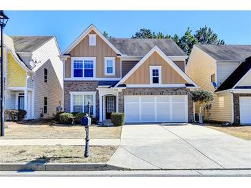 Charming two-story home with brick accents and a well-maintained front yard at 2157 Staunton Dr, Duluth, GA 30096