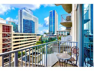 City views from condo balcony with seating and a metal railing at 860 Peachtree St # 811, Atlanta, GA 30308