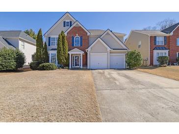 Charming two-story home with brick accents and a two-car garage at 3624 Bancroft Main Nw, Kennesaw, GA 30144