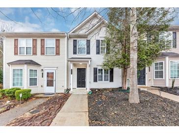 Charming townhouse with a well-maintained lawn and classic architectural details at 745 Crestwell Sw Cir, Atlanta, GA 30331