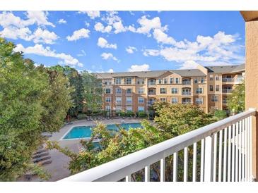 A beautiful view of the community pool and landscaping from a private balcony at 10 Perimeter Summit Ne Blvd # 4312, Atlanta, GA 30319