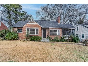 Charming brick home featuring a screened in porch, mature trees, and a classic design at 1579 Mayflower Sw Ave, Atlanta, GA 30311