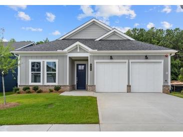 Charming single-Gathering home with a two-car garage, well-maintained lawn, and welcoming curb appeal at 408 Vinca Nw Cir, Kennesaw, GA 30144