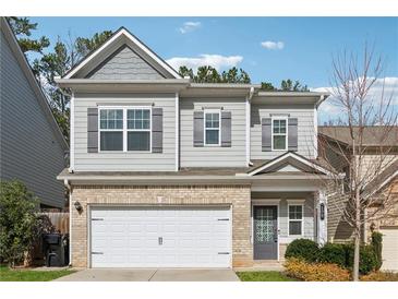 Charming two-story home with a brick and siding exterior and a two-car garage at 103 Bryon Ln, Acworth, GA 30102