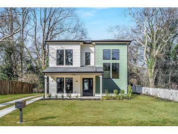 Charming two-story home with well-manicured lawn and a mix of modern design and classic elements at 1273 Danner Se St, Atlanta, GA 30316