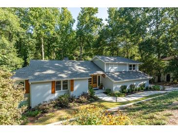 Charming two-story home with a lush, landscaped front yard and a welcoming walkway at 3339 Somerset Se Trce, Marietta, GA 30067