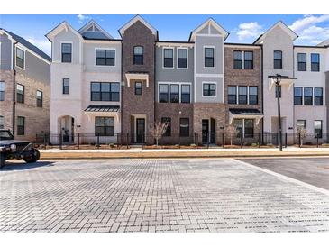 Charming townhomes with a brick and siding facade, black trim, and well-manicured landscaping at 355 Walker Avenue, Roswell, GA 30076