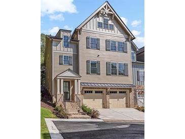 Charming three-story home with attached two-car garage and inviting front entrance at 304 Trecastle Ln # 28, Canton, GA 30114
