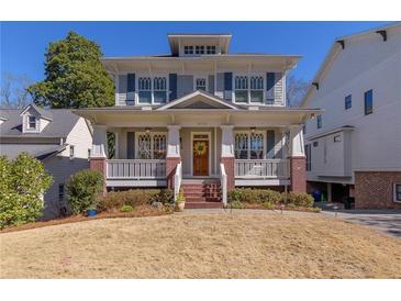 Charming two-story home features a welcoming front porch, landscaped yard, and classic architectural details at 2629 Apple Valley Ne Rd, Brookhaven, GA 30319