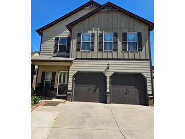 Charming two-story home featuring a two-car garage and welcoming front porch at 2761 Trebek Ct, Mcdonough, GA 30253