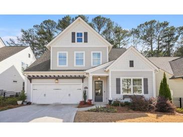 Charming two-story home features a two-car garage, grey siding and black shutters at 1078 Amarose Ln, Marietta, GA 30066