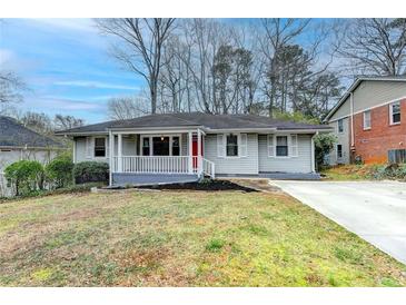 Charming single-story home with a covered porch and red front door at 1830 Jan Hill Ne Ln, Atlanta, GA 30329