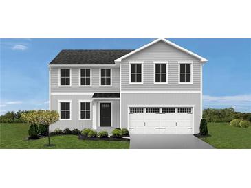 Charming two-story home with gray siding, a black front door, and an attached two car garage at , Stone Mountain, GA 30087