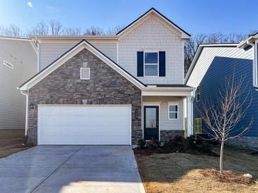 Charming two-story home featuring a stone facade and a two-car garage, offering a blend of modern design and convenience at 735 Shetland Trl, Cartersville, GA 30121