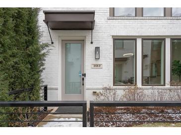 Contemporary home featuring painted brick, modern windows, and stylish entryway with a covered porch at 332 Gibson Se St, Atlanta, GA 30316