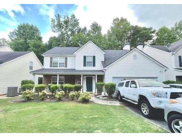 Inviting two-story home features a two-car garage and meticulously maintained landscaping at 2782 Wynhaven Oaks Way, Lawrenceville, GA 30043