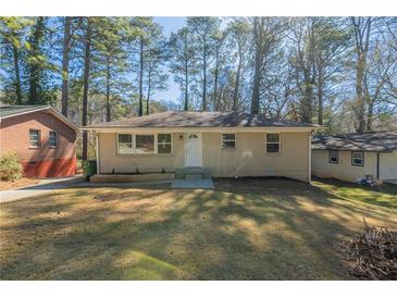 Charming single-story home with brick and manicured front yard, perfect for suburban living at 158 Polar Rock Sw Dr, Atlanta, GA 30315