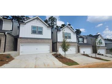 Charming townhomes with eye-catching exteriors, and two car garage at 1393 Vayda Ct, Marietta, GA 30066