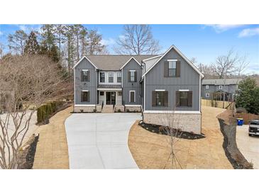 Beautiful exterior elevation of a modern home with a long driveway and manicured landscaping at 2517 Canopy Ct, Marietta, GA 30066