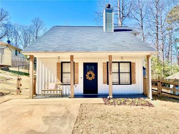 Charming renovated home featuring a cozy front porch and inviting curb appeal with great natural light at 2550 Belaire Dr, Cumming, GA 30041