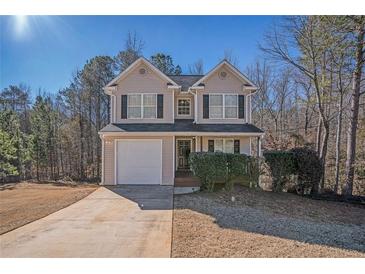 Charming two-story home featuring a well-maintained lawn and attached garage at 30 Sampson Ct, Covington, GA 30016