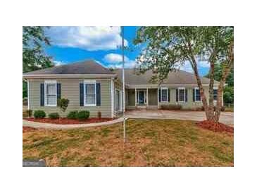 Charming single-story home with well-maintained lawn and mature tree in a tranquil setting at 72 Grayson New Hope Rd, Grayson, GA 30017