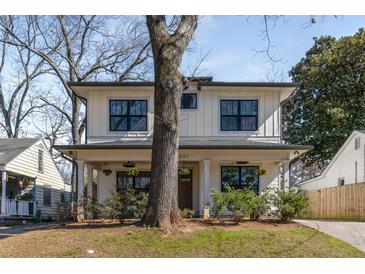 Charming two-story home with a landscaped front yard and modern farmhouse design at 231 Sisson Ne Ave, Atlanta, GA 30317