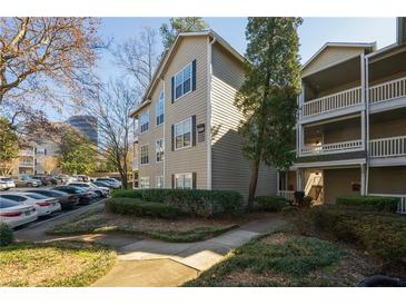 Charming condo building with manicured landscaping and ample parking at 1250 Parkwood Se Cir # 2114, Atlanta, GA 30339