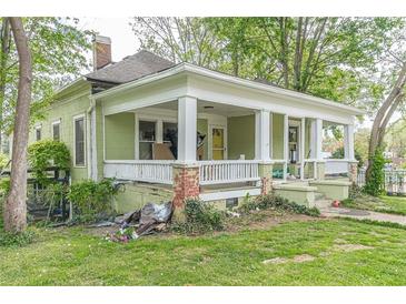 Covered porch with white pillars and columns, offering an inviting entrance and outdoor living space at 3670 Union Ave, Atlanta, GA 30354