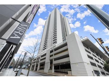 Stunning exterior view of the high-rise condo building, The Mira, with a view of the parking deck at 1280 W Peachtree Nw St # 3303, Atlanta, GA 30309