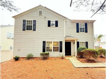 Charming two-story home featuring black shutters and manicured landscaping at 235 Windcroft Nw Ln, Acworth, GA 30101