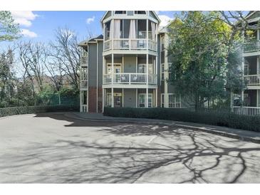 A condo building with beautiful balconies surrounded by lush landscaping at 1115 Mcgill Park Ne Ave, Atlanta, GA 30312