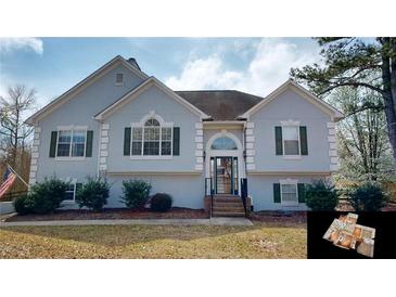 Charming two-story home featuring a well-maintained lawn, trimmed bushes, and a welcoming front entrance at 3336 Franklin Forest Dr, Winston, GA 30187