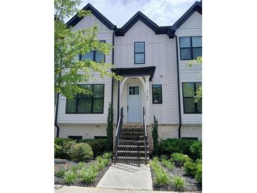 Charming townhome with a well-maintained front yard and striking architectural details at 3186 Kincaid Dr, Decatur, GA 30033