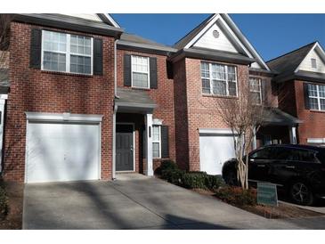 Charming brick townhouse with a private driveway and a one car garage at 3835 Pleasant Oaks Dr, Lawrenceville, GA 30044