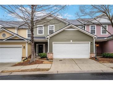 Charming townhome features a two-car garage and colorful, stylish exterior siding at 6000 Suttles Sw Dr, Atlanta, GA 30331