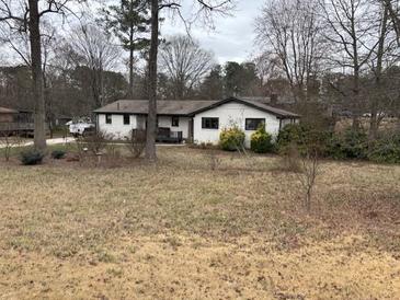 Charming single-story home with a neutral exterior and a spacious lawn at 170 Dillard Ne Dr, Kennesaw, GA 30144