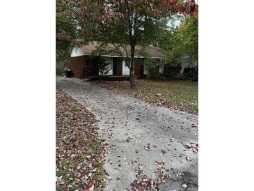 Street view of a single story brick home with a driveway at 2802 Ocean Valley Dr, Atlanta, GA 30349