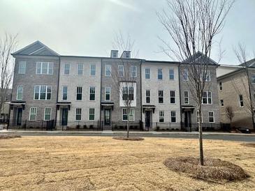 Charming townhome exterior with brick facade and well-maintained landscaping at 169 Ward