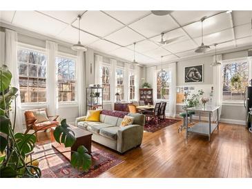 Bright living room with hardwood floors, large windows, and a comfortable seating area at 138 Kirkwood Ne Rd # 9, Atlanta, GA 30317